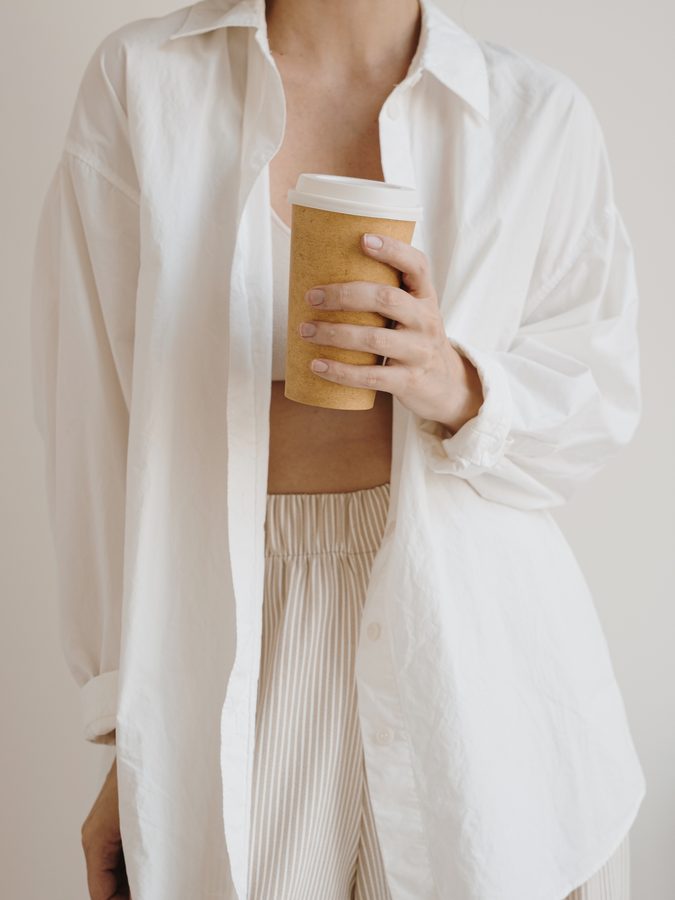 Womenswear — oversized white shirt with striped bottoms, casual daywear