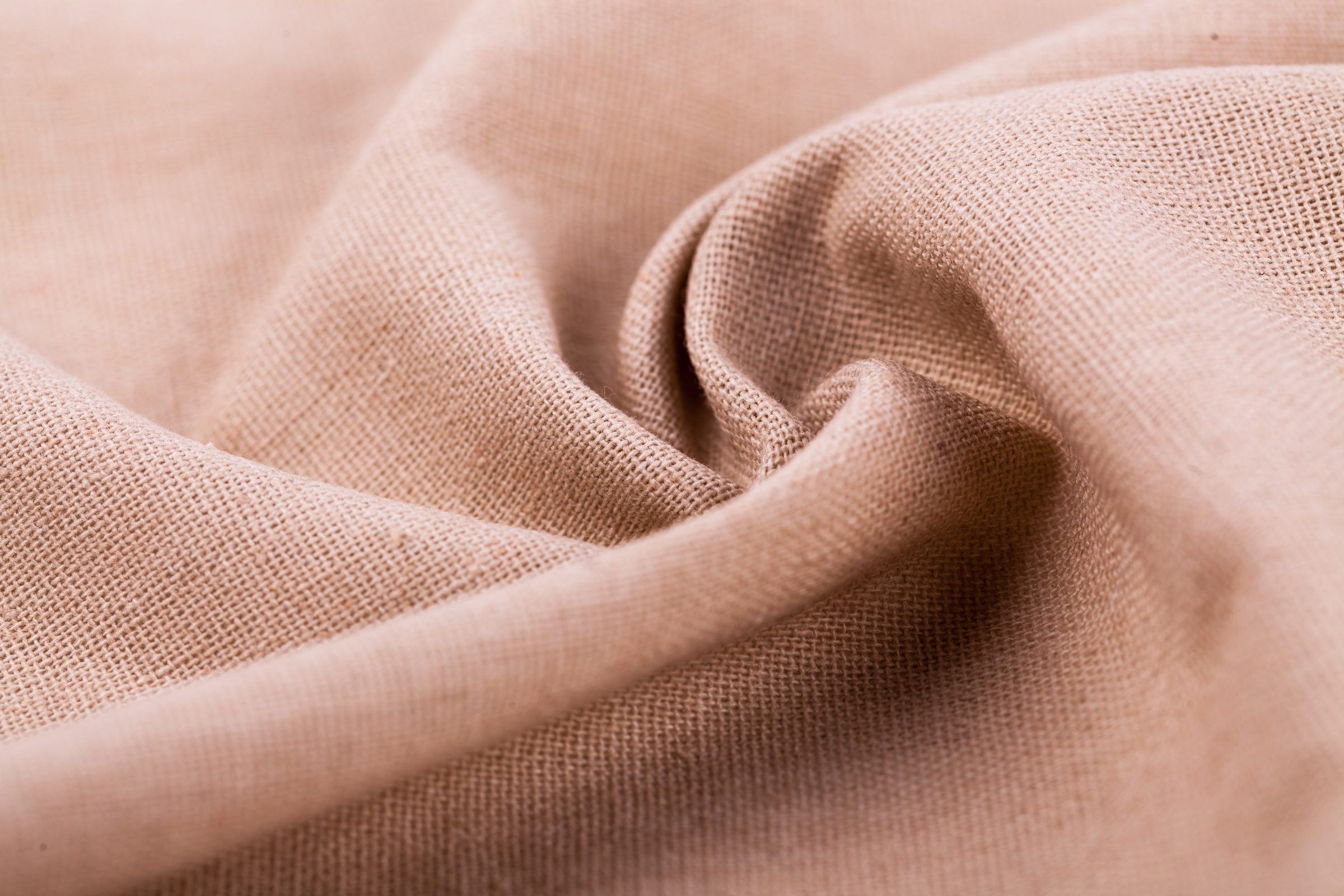 Cream and beige linen folds in warm light